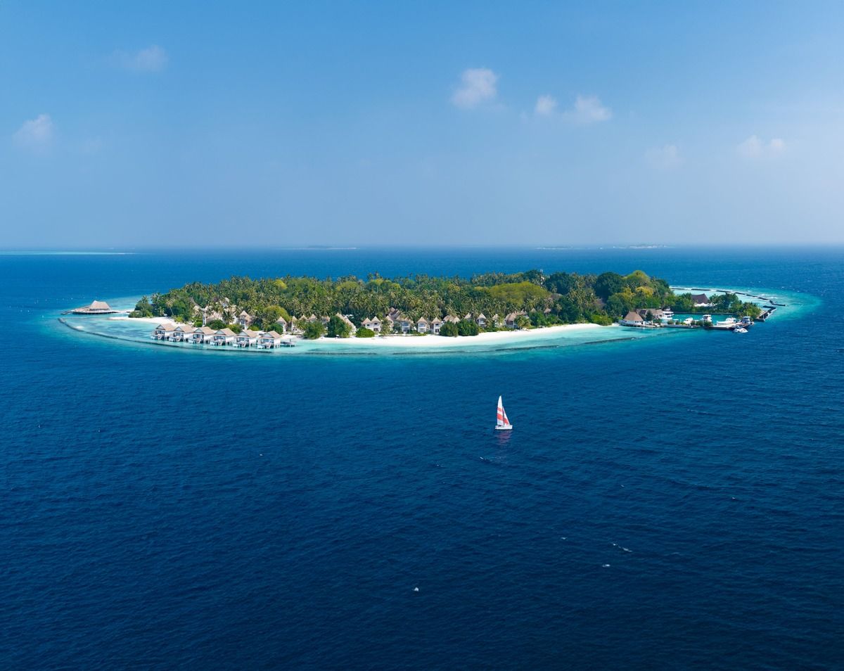 Aerial view of Bandos Maldives surrounded by its lagoon